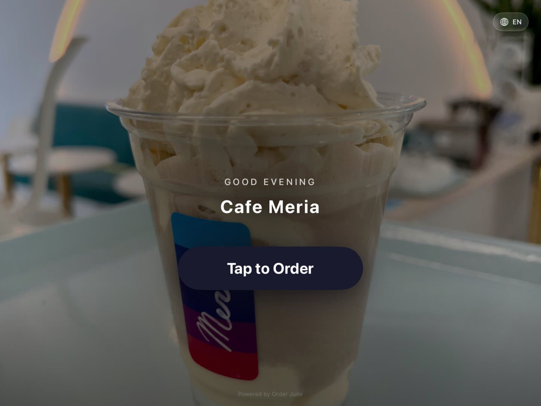 The menu view on Order June — grid of item tiles with photos and prices, category sidebar on the left